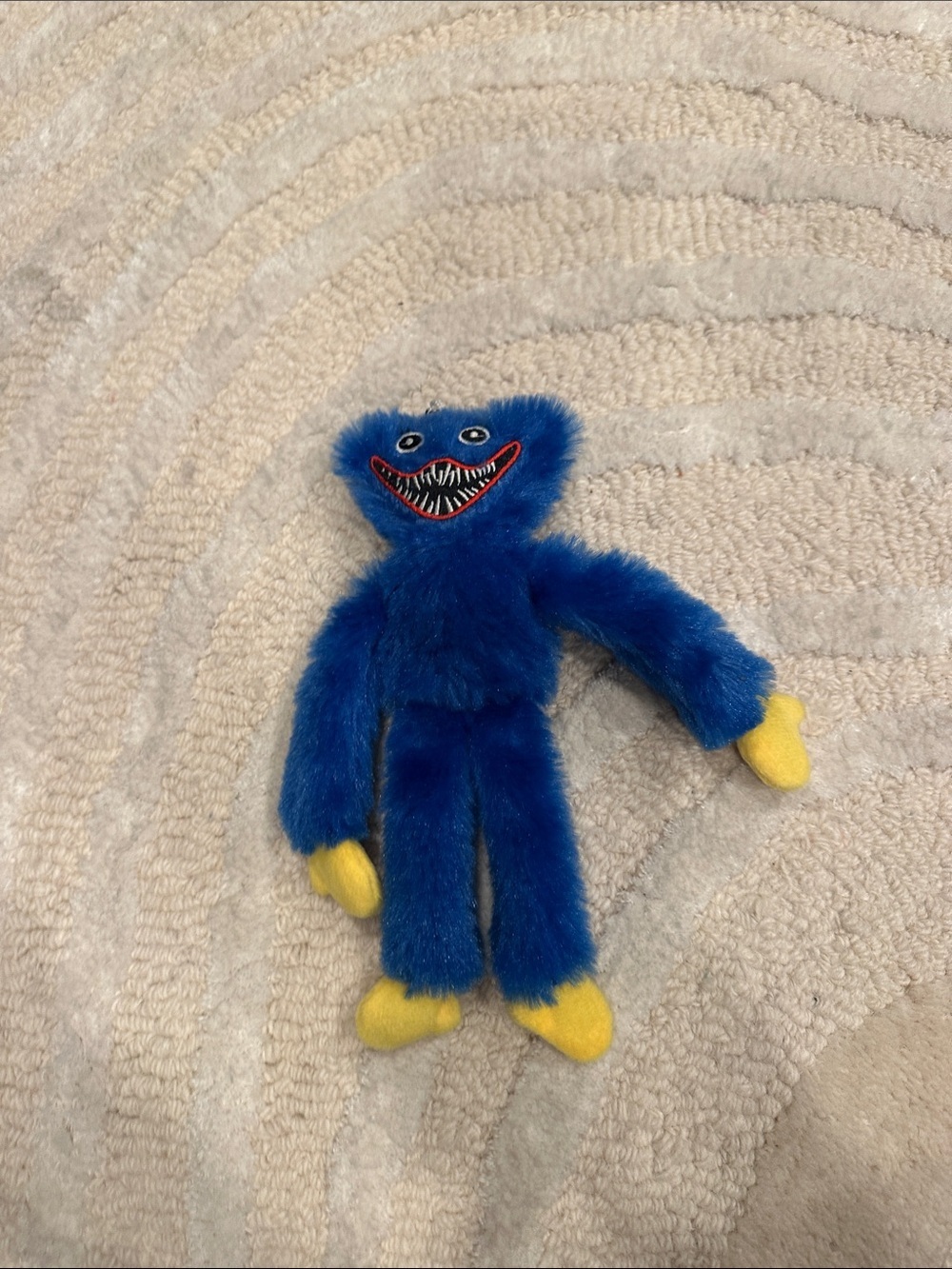 Blue Fuzzy Plush Character Toy with Yellow Hands and Feet